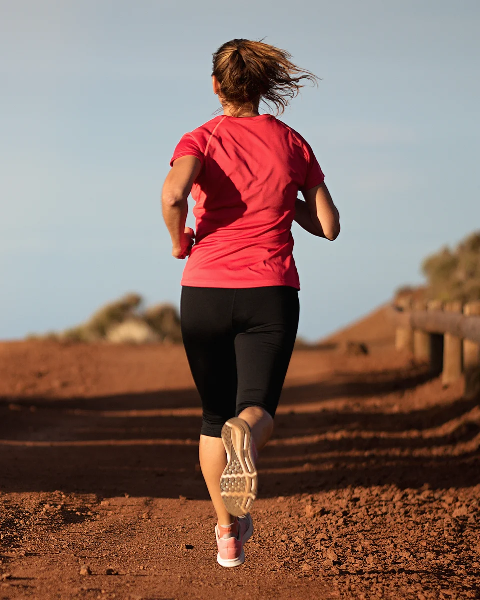 Woman running on an open road