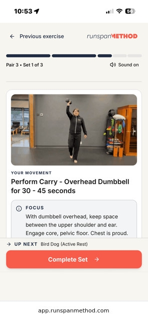 RunSpan Method overhead dumbbell carry demonstration and coaching cues